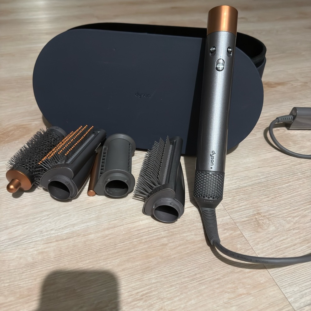 Dyson multi-attachment hair styler in gray and copper